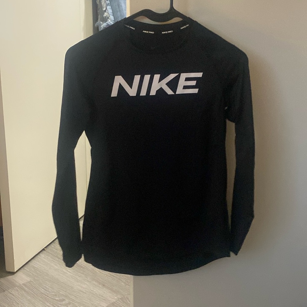 black “NIKE” compression shirt
